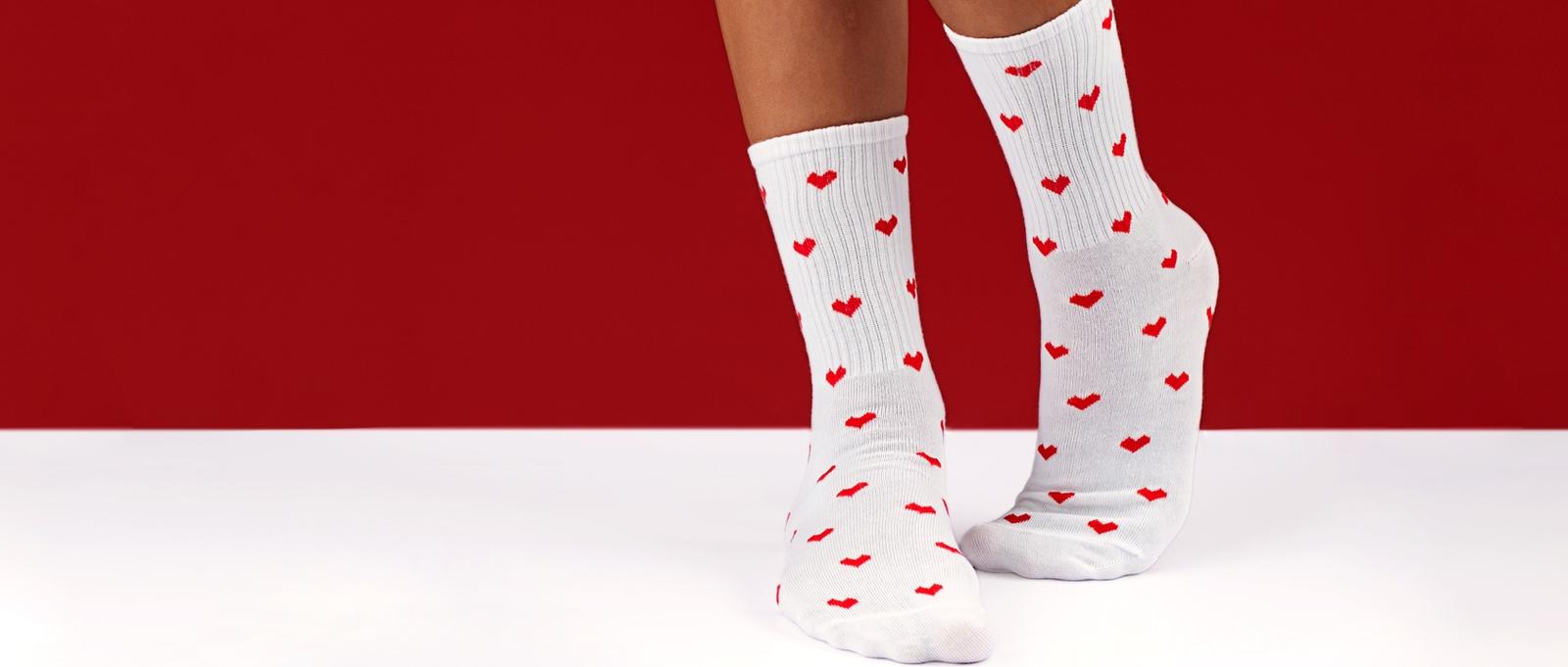 Female legs with heart socks.